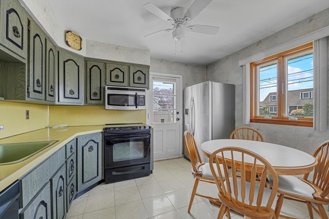 116 Intervale Ave, Farmingdale, NY 11735 - kitchen featuring black appliances, a sink, light countertops, ceiling fan, and light tile patterned floors