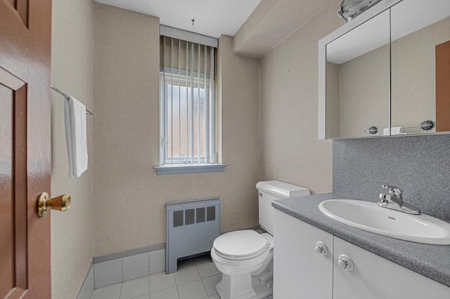 116 Intervale Ave, Farmingdale, NY 11735 - bathroom with radiator, toilet, tile patterned floors, and vanity