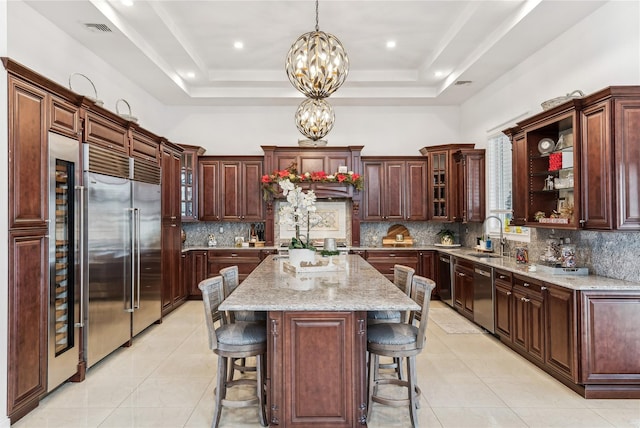 2854 Whaleneck Dr, Merrick, NY 11566 - kitchen featuring stainless steel appliances, a chandelier, light tile patterned flooring, and a sink