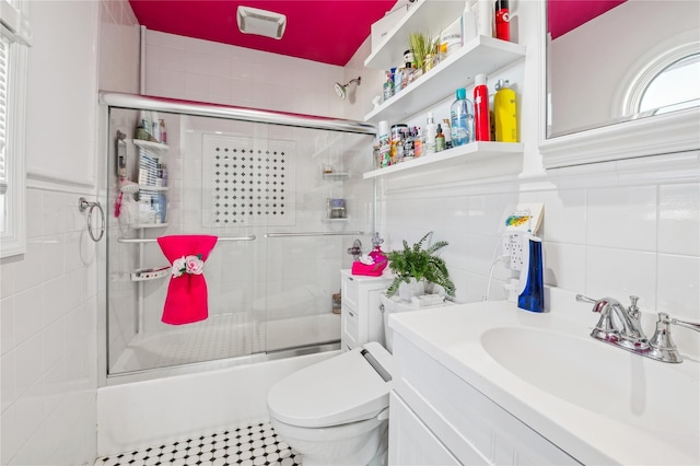 2854 Whaleneck Dr, Merrick, NY 11566 - bathroom featuring tile walls, bath / shower combo with glass door, vanity, and toilet