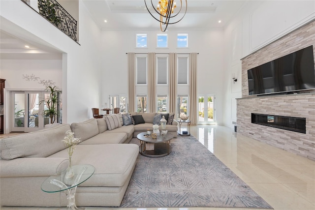 2854 Whaleneck Dr, Merrick, NY 11566 - living room with a high ceiling, a chandelier, tile patterned floors, a stone fireplace, and recessed lighting