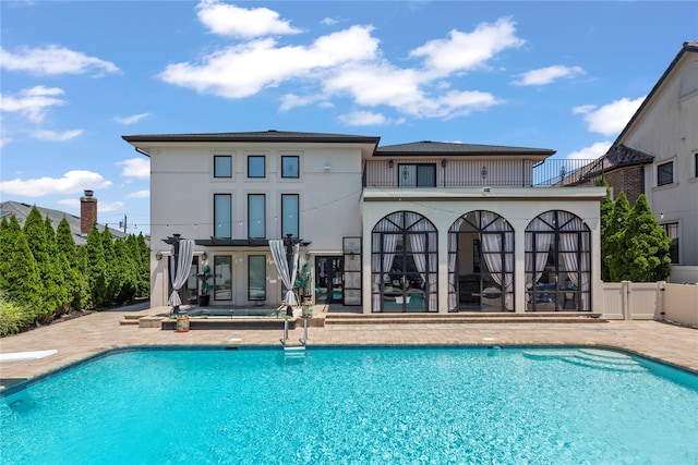 2854 Whaleneck Dr, Merrick, NY 11566 - swimming pool featuring a patio and french doors
