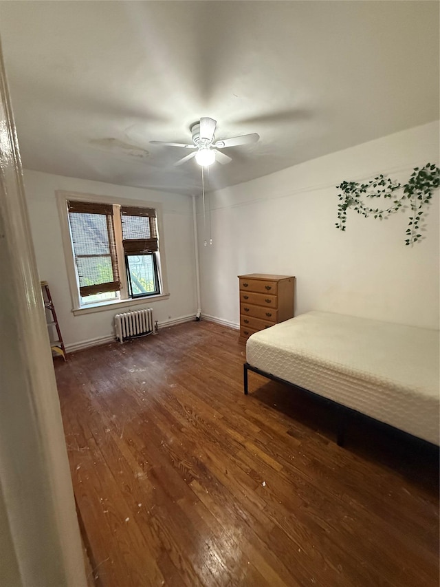 1177 Anderson Ave Unit 2B, Bronx, NY 10452 - bedroom with radiator, wood finished floors, ceiling fan, and baseboards