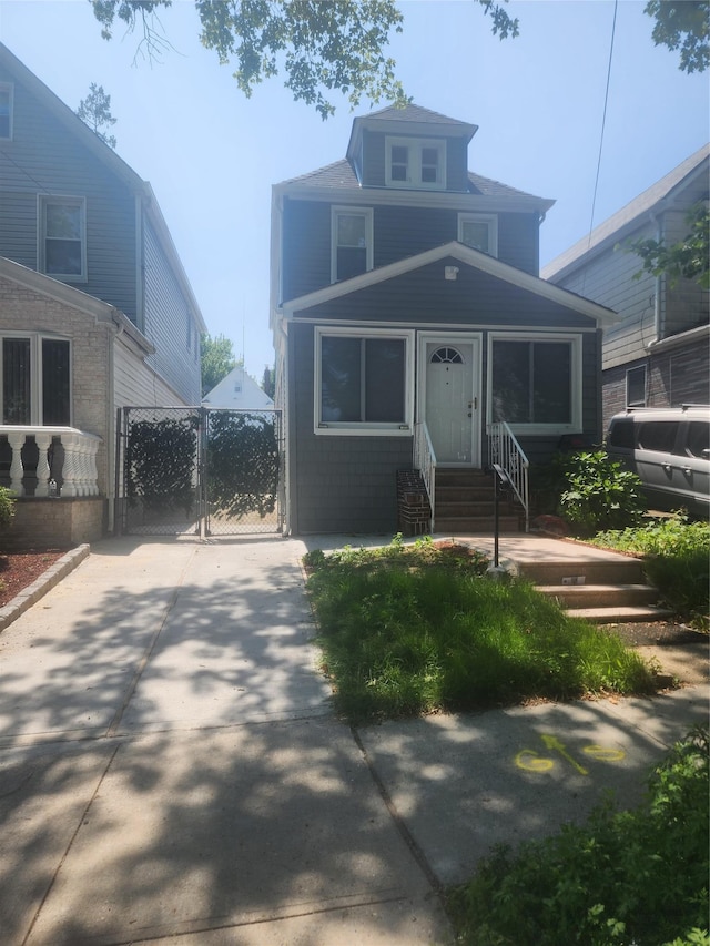 88-38 201st St, Hollis, NY 11423 - view of front facade with a gate and entry steps