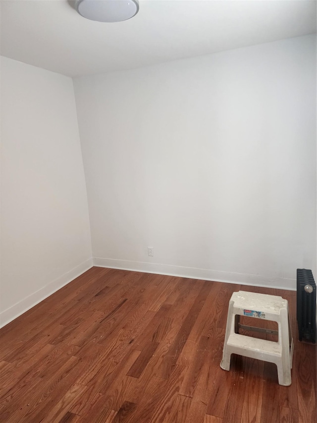 88-38 201st St, Hollis, NY 11423 - spare room with wood finished floors and baseboards