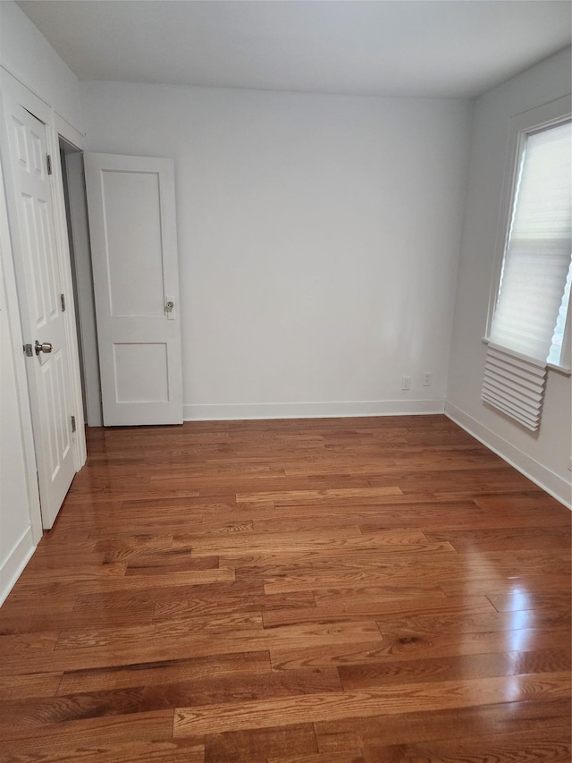 88-38 201st St, Hollis, NY 11423 - spare room featuring wood finished floors and baseboards