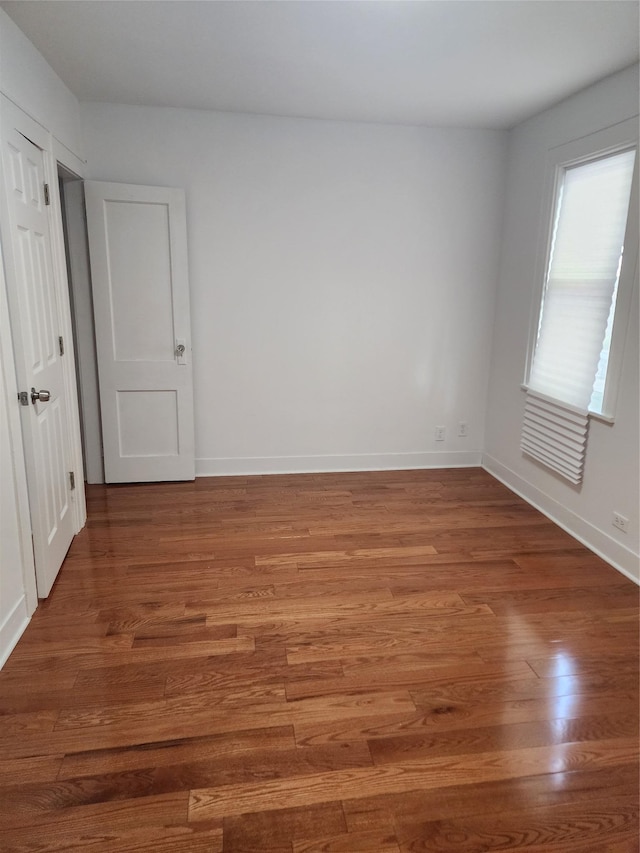 88-38 201st St, Hollis, NY 11423 - empty room featuring wood finished floors and baseboards