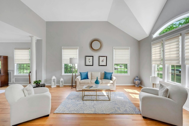 3 Vista Dr, Baldwin Place, NY 10505 - living room with lofted ceiling, wood finished floors, and decorative columns