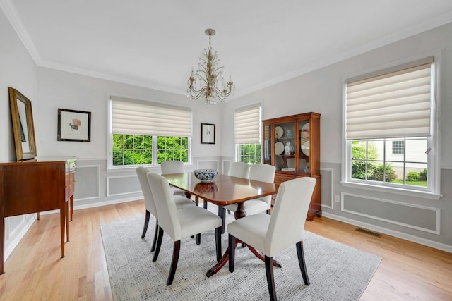 3 Vista Dr, Baldwin Place, NY 10505 - dining room featuring a chandelier, light wood-style floors, ornamental molding, plenty of natural light, and wainscoting