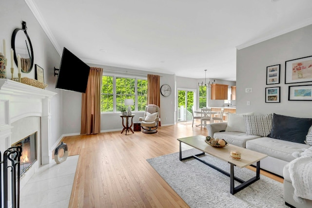 3 Vista Dr, Baldwin Place, NY 10505 - living area featuring crown molding, light wood-style floors, and a fireplace with flush hearth