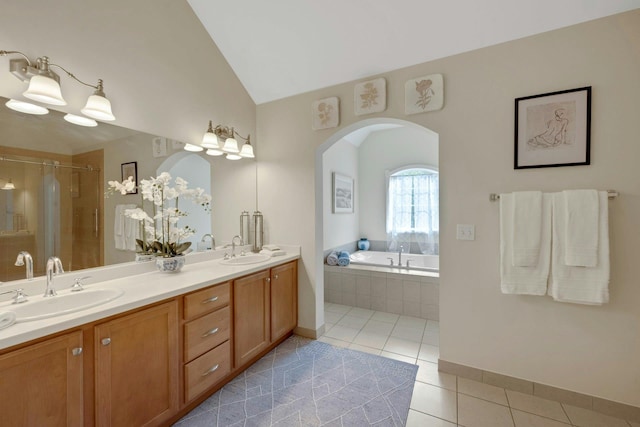 3 Vista Dr, Baldwin Place, NY 10505 - bathroom featuring tile patterned flooring, double vanity, a bath, lofted ceiling, and a stall shower