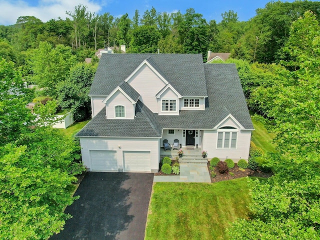 3 Vista Dr, Baldwin Place, NY 10505 - traditional-style home featuring asphalt driveway, a shingled roof, and a front yard