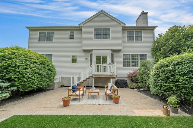 3 Vista Dr, Baldwin Place, NY 10505 - back of property with a chimney and a patio