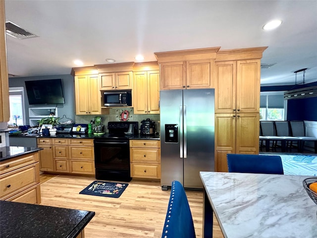 70 Nichols Rd, Nesconset, NY 11767 - kitchen featuring black appliances, recessed lighting, light wood-style floors, dark stone countertops, and light brown cabinets