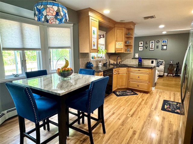 70 Nichols Rd, Nesconset, NY 11767 - kitchen with black dishwasher, healthy amount of natural light, light wood finished floors, and recessed lighting