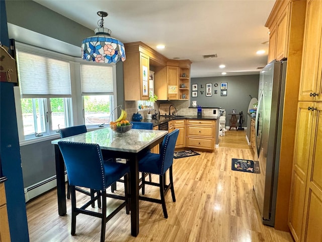 70 Nichols Rd, Nesconset, NY 11767 - dining space with a baseboard radiator, light wood-style floors, and recessed lighting