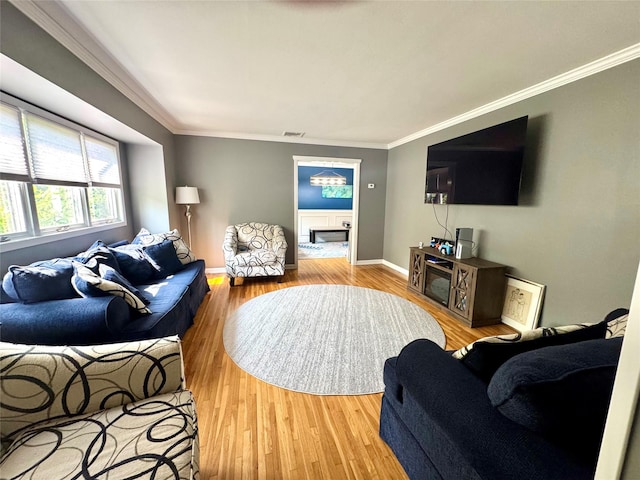 70 Nichols Rd, Nesconset, NY 11767 - living room with ornamental molding, wood finished floors, baseboards, and a fireplace