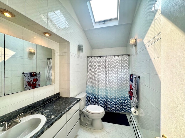 70 Nichols Rd, Nesconset, NY 11767 - bathroom with a skylight, a baseboard radiator, toilet, tile patterned flooring, and vanity