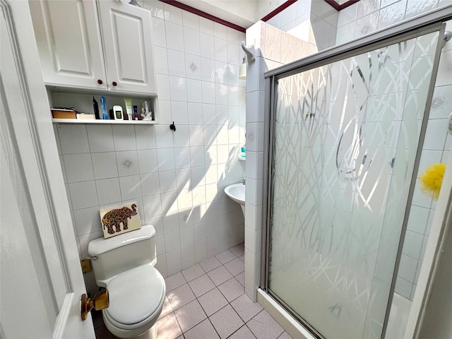 70 Nichols Rd, Nesconset, NY 11767 - bathroom featuring tile walls, toilet, tile patterned floors, and a shower stall