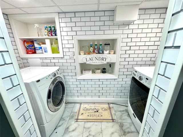 70 Nichols Rd, Nesconset, NY 11767 - laundry area featuring marble finish flooring and separate washer and dryer