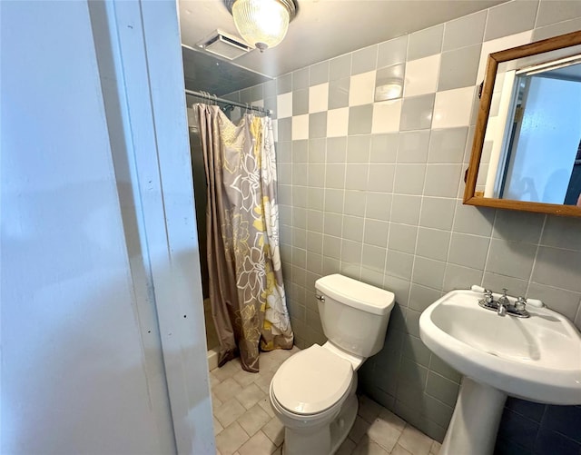 70 Nichols Rd, Nesconset, NY 11767 - full bath featuring tile walls, toilet, a shower with curtain, and a sink