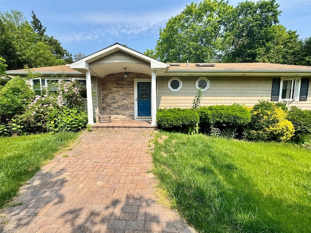 70 Nichols Rd, Nesconset, NY 11767 - ranch-style house with a porch and stone siding