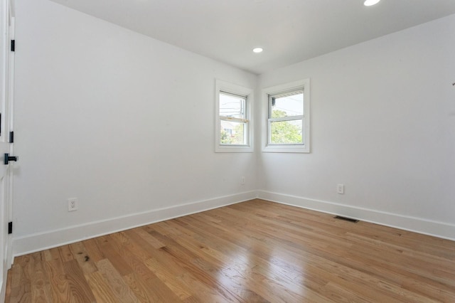 1541 Midian St, North Merrick, NY 11566 - empty room with baseboards, light wood-style flooring, and recessed lighting