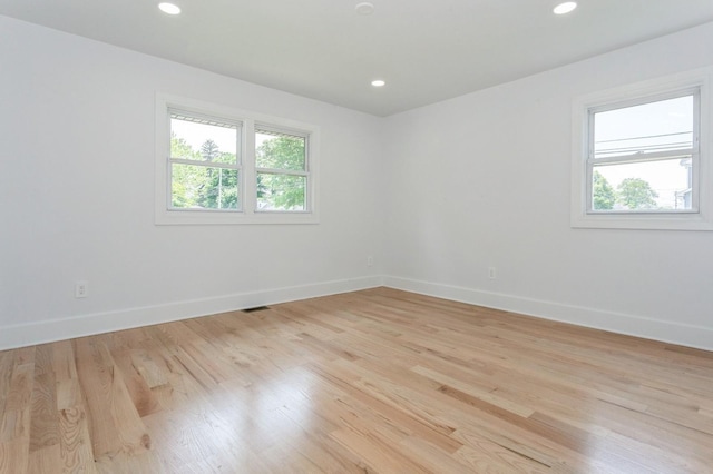1541 Midian St, North Merrick, NY 11566 - unfurnished room featuring baseboards, light wood finished floors, and recessed lighting