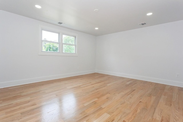 1541 Midian St, North Merrick, NY 11566 - unfurnished room with baseboards, light wood finished floors, and recessed lighting