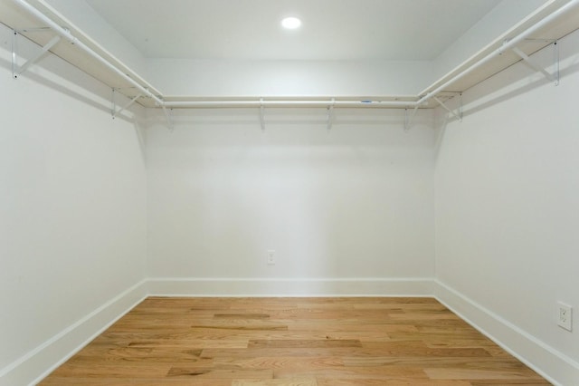 1541 Midian St, North Merrick, NY 11566 - walk in closet with light wood-style floors