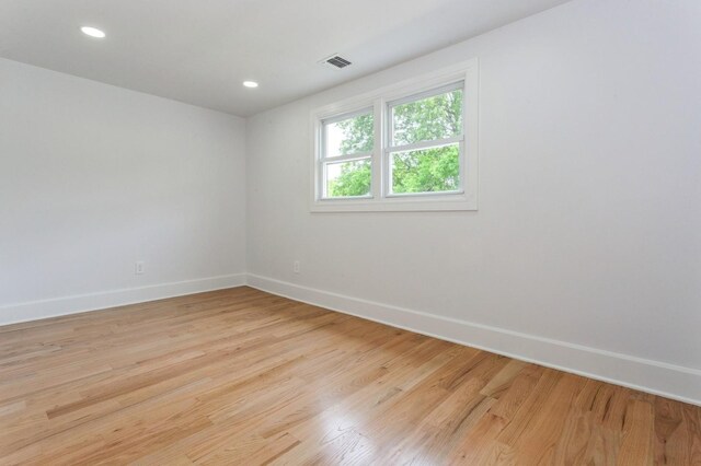 1541 Midian St, North Merrick, NY 11566 - spare room with baseboards, light wood finished floors, and recessed lighting