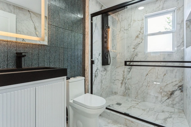1541 Midian St, North Merrick, NY 11566 - bathroom featuring toilet, a marble finish shower, tile walls, vanity, and marble finish floors