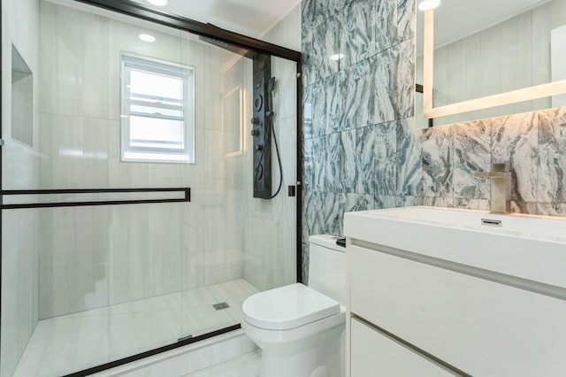 1541 Midian St, North Merrick, NY 11566 - full bath with toilet, tile walls, a shower stall, vanity, and tasteful backsplash