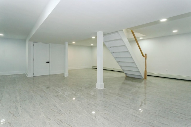 1541 Midian St, North Merrick, NY 11566 - finished below grade area with baseboard heating, stairway, recessed lighting, and baseboards