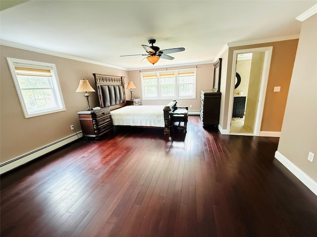 56 Elwood Rd, Northport, NY 11768 - bedroom with multiple windows, baseboard heating, crown molding, baseboards, and dark wood-style flooring