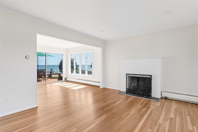167 Secatogue Ln W, West Islip, NY 11795 - unfurnished living room featuring a baseboard radiator, light wood-style floors, baseboard heating, and a fireplace