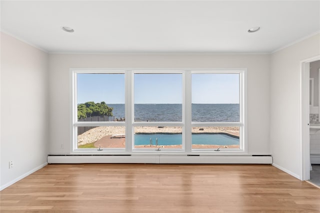 167 Secatogue Ln W, West Islip, NY 11795 - spare room with crown molding, baseboard heating, light wood-type flooring, baseboards, and recessed lighting