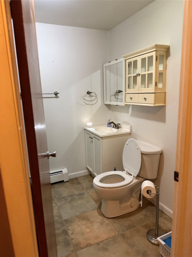 1546 Denning Rd, Claryville, NY 12725 - half bathroom featuring baseboard heating, vanity, toilet, baseboards, and tile patterned flooring