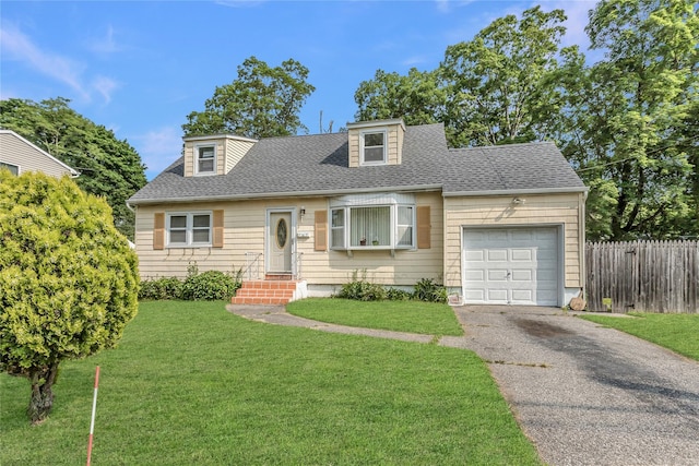 18 Hilliard Ave, Central Islip, NY 11722 - cape cod house with an attached garage, roof with shingles, and driveway