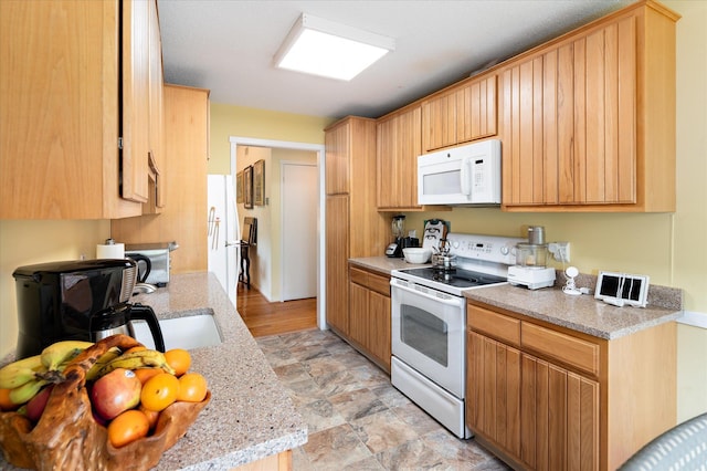 298 Heritage Hls Unit A, Somers, NY 10589 - kitchen with white appliances and light stone countertops