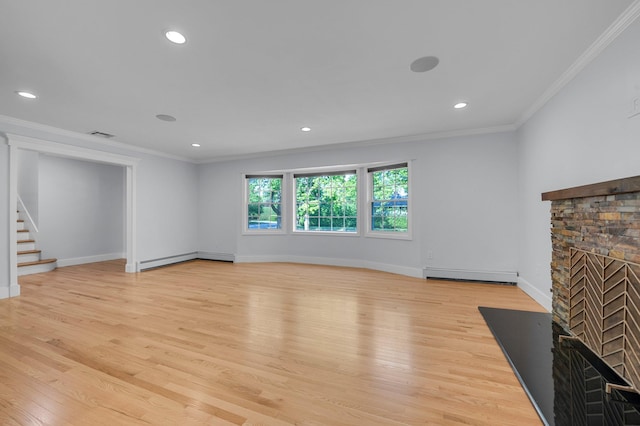 56 Washington Ave, Garden City, NY 11530 - unfurnished living room featuring a stone fireplace, crown molding, baseboard heating, stairway, and light wood-style floors
