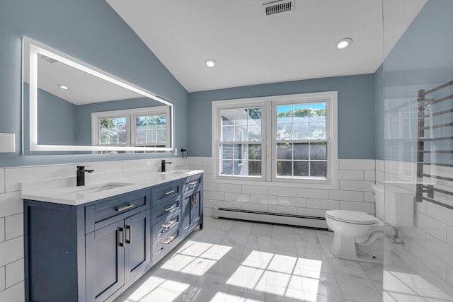 56 Washington Ave, Garden City, NY 11530 - bathroom with a baseboard heating unit, tile walls, toilet, lofted ceiling, and a wainscoted wall