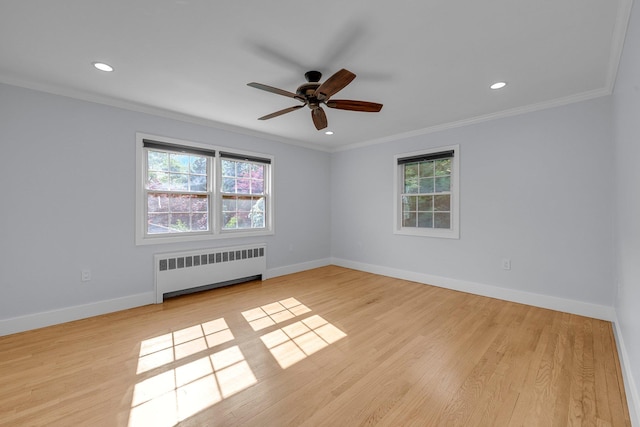56 Washington Ave, Garden City, NY 11530 - empty room with radiator heating unit, healthy amount of natural light, baseboards, ornamental molding, and ceiling fan