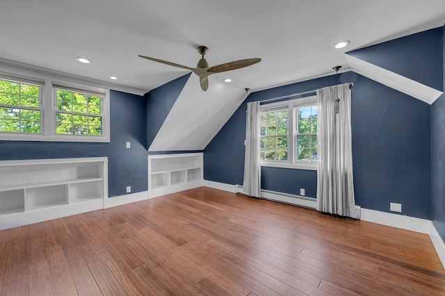 56 Washington Ave, Garden City, NY 11530 - additional living space featuring a ceiling fan, baseboards, healthy amount of natural light, lofted ceiling, and baseboard heating