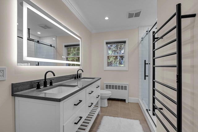 56 Washington Ave, Garden City, NY 11530 - bathroom with radiator, a stall shower, double vanity, ornamental molding, and toilet