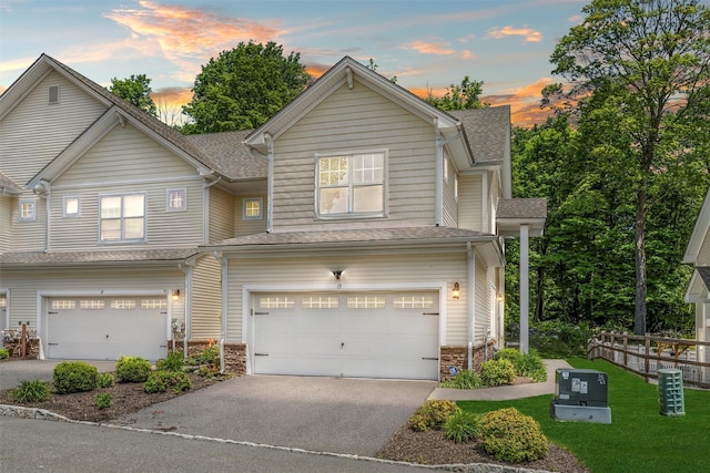 19 Woodrose Ct, Middletown, NY 10940 - view of front facade with a garage, asphalt driveway, stone siding, and roof with shingles
