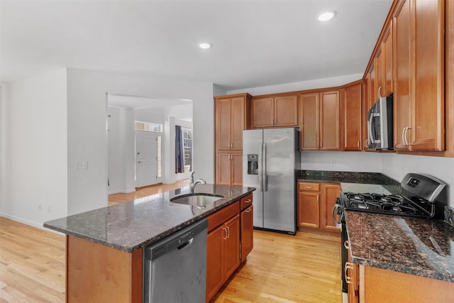 19 Woodrose Ct, Middletown, NY 10940 - kitchen featuring stainless steel appliances, a sink, light wood-style floors, dark stone countertops, and recessed lighting