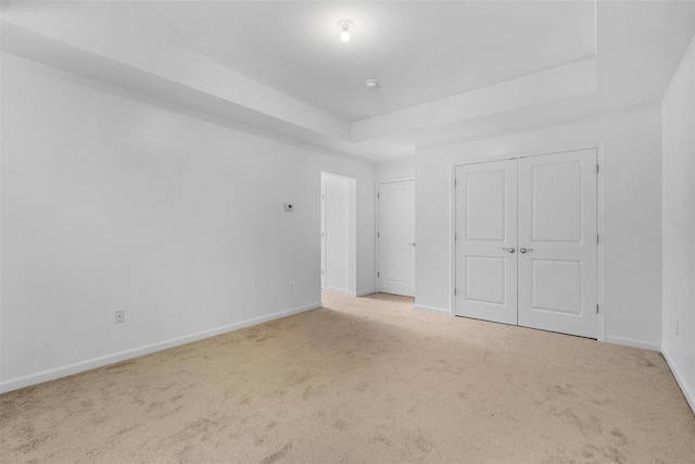 19 Woodrose Ct, Middletown, NY 10940 - unfurnished bedroom with carpet, baseboards, and a tray ceiling