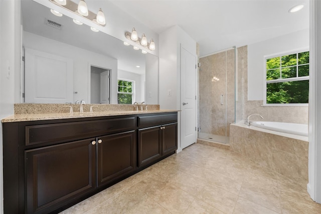 19 Woodrose Ct, Middletown, NY 10940 - bathroom with healthy amount of natural light, double vanity, a shower stall, and tile patterned flooring