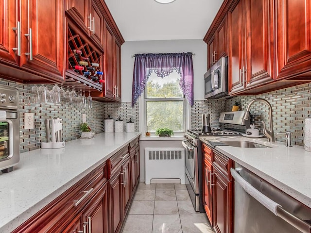 1234 Midland Ave Unit 5C, Bronxville, NY 10708 - kitchen with appliances with stainless steel finishes, dark brown cabinets, a sink, and tasteful backsplash